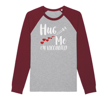 Load image into Gallery viewer, Hug Me I&#39;m Vaccinated Organic Raglan Long Sleeve Shirt
